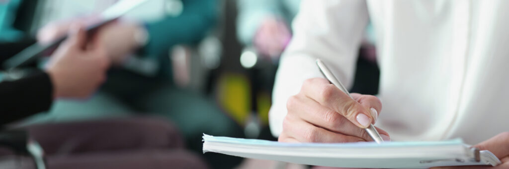 Business people for training write information in notebook